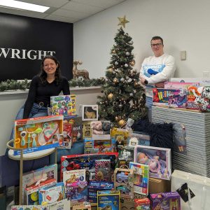 Natalia Marin and Roderick MacKay with donations for the William Wright Commercial Toy Drive 2023